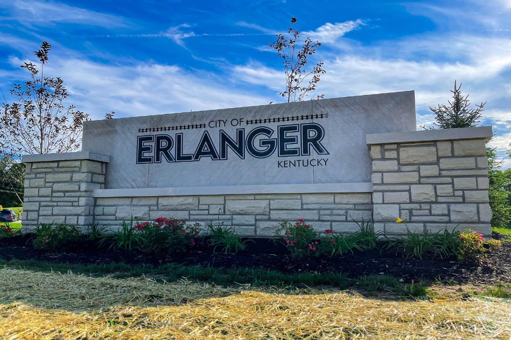 Erlanger Ky - ABS Services Stone sign reading City of Erlanger, Kentucky, with landscaped flower beds in front.